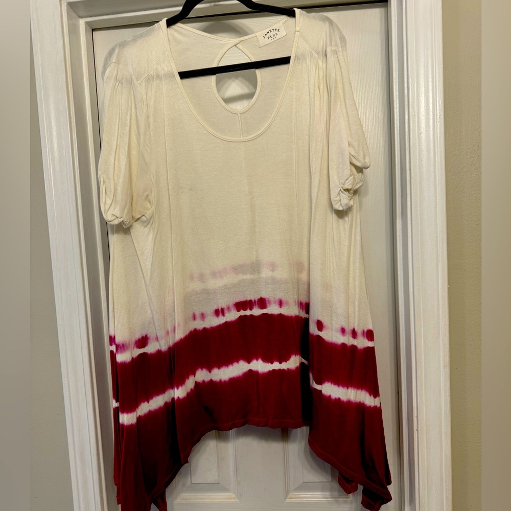 Janette Plus brand off white top with pink tie dye detail at the bottom.